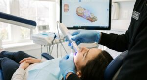 Dentist using digital intraoral scanner to capture 3D impression of patient's teeth at View Dental Raleigh